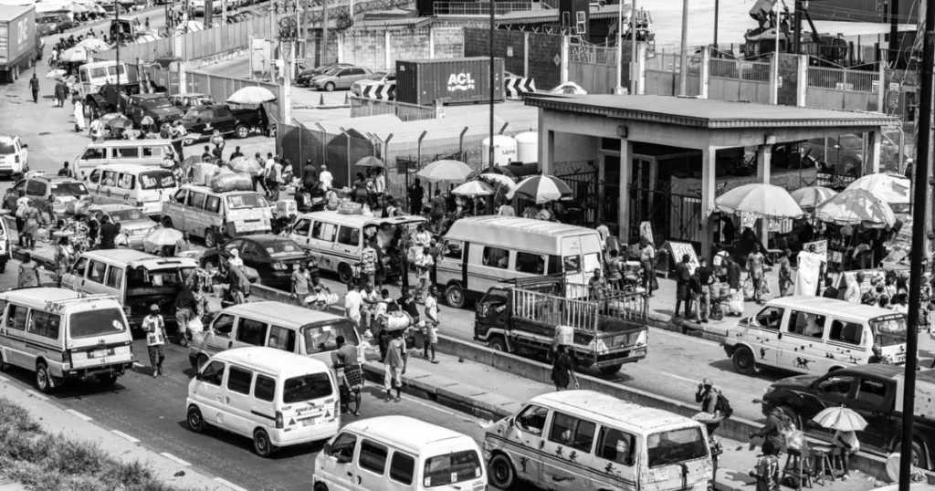 Busy Nigerian street scene with vehicles and vendors, illustrating fuel and transport budgeting
