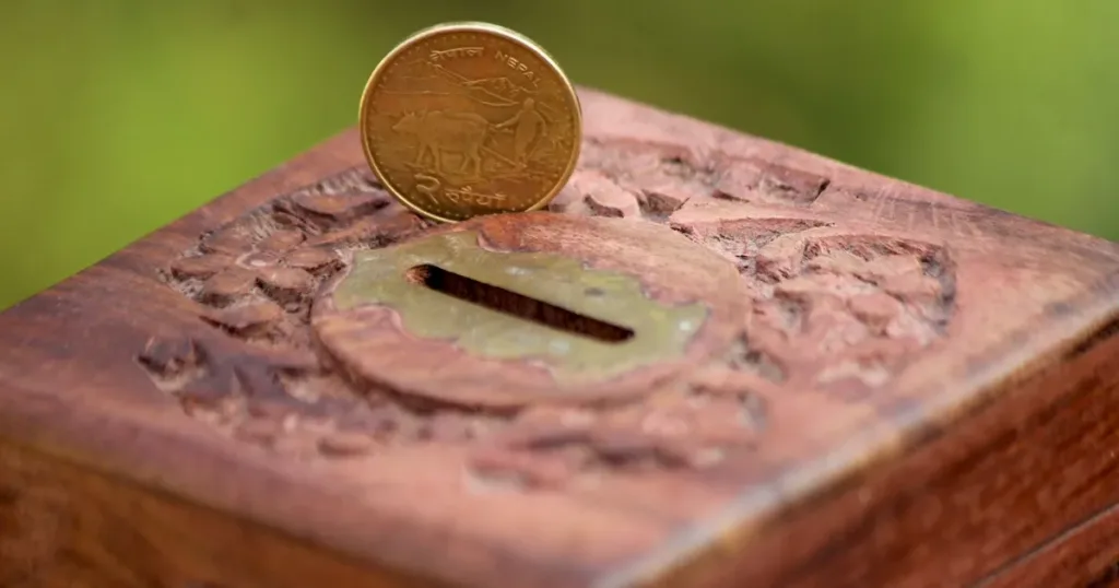 Piggy bank with Indian rupee coins symbolizing savings