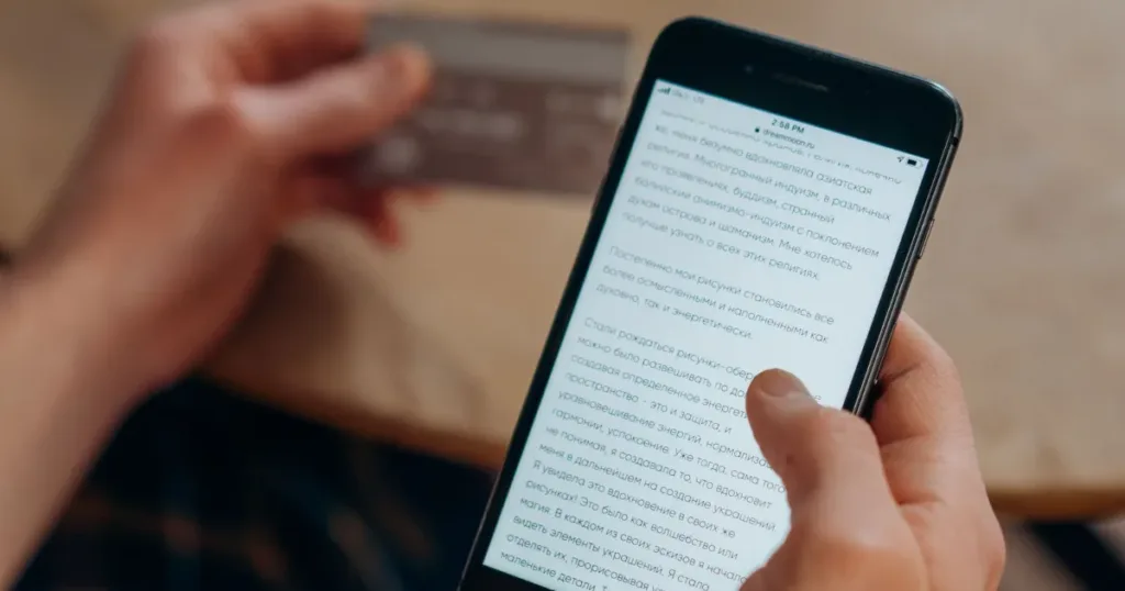 Person examining a suspicious message on smartphone