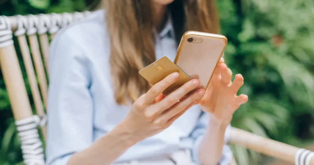 Indian woman checking her bank account on a smartphone