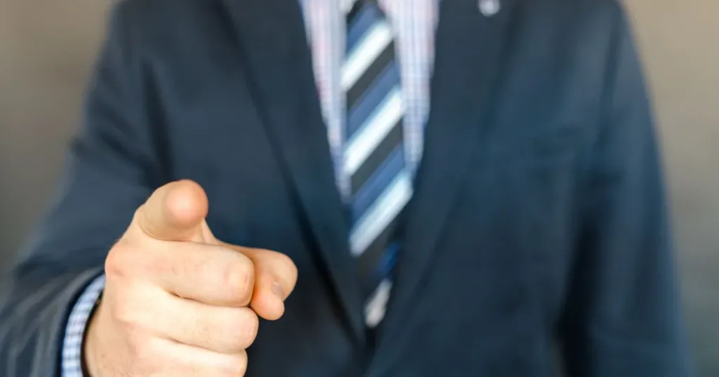 Businessman pointing forward, symbolizing progress toward a regular credit card