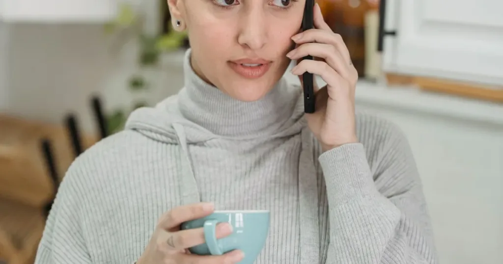 Indian woman at home using a smartphone