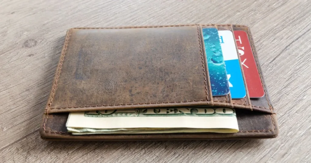 Close-up of a wallet with credit cards including a starter card