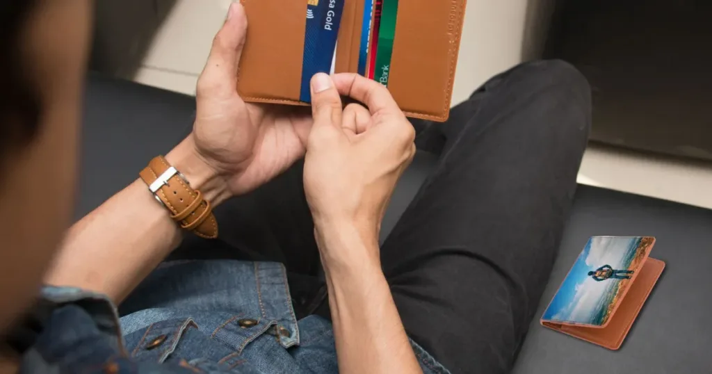 Hand choosing a card from a wallet