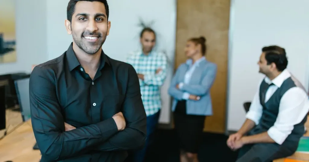 Confident young professional standing in a modern office