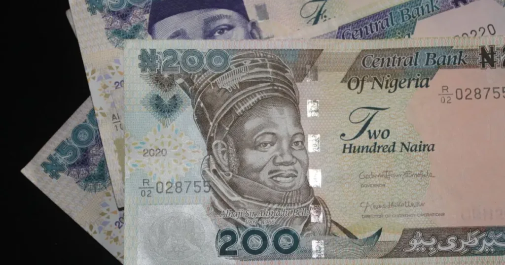 Close-up detail of Nigerian naira banknotes, showing N200 and N500 notes