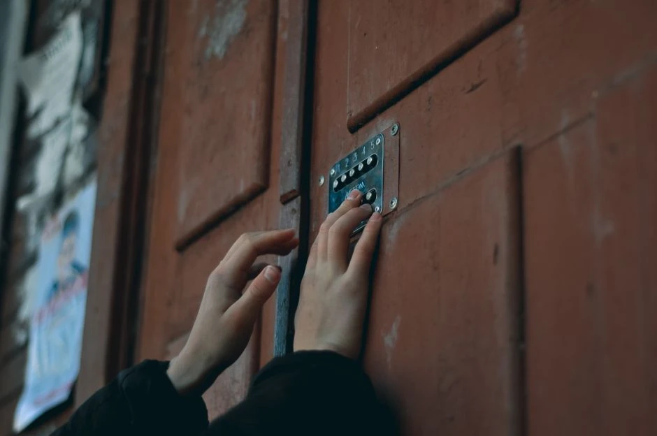 Hand holding a phone with a security lock screen