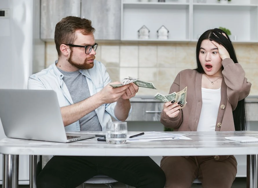 Filipino family budgeting together at home