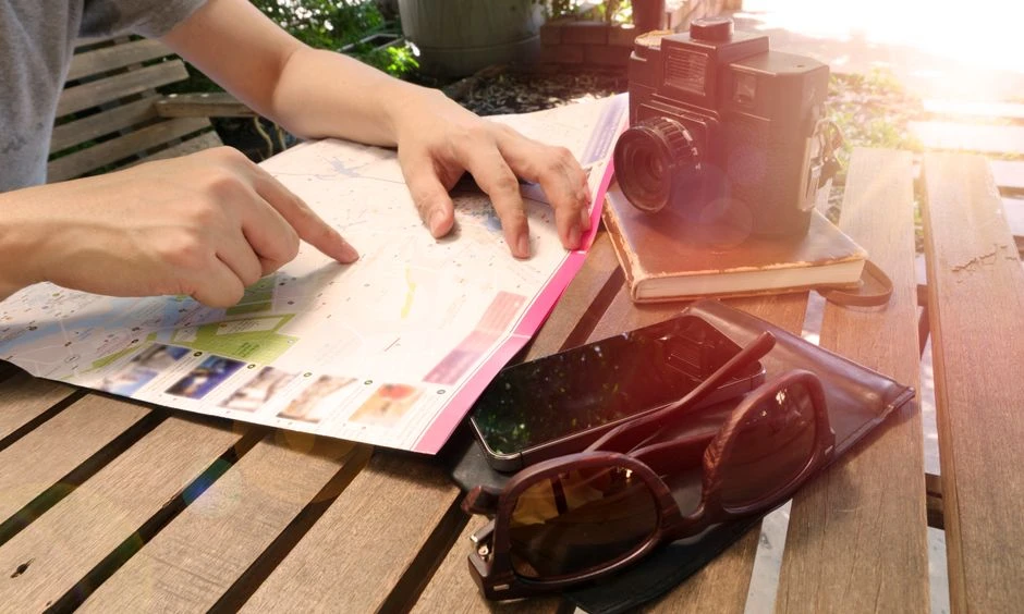 Person planning a path forward in a notebook