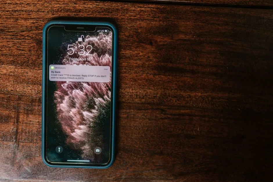 Phone showing a suspicious warning text message