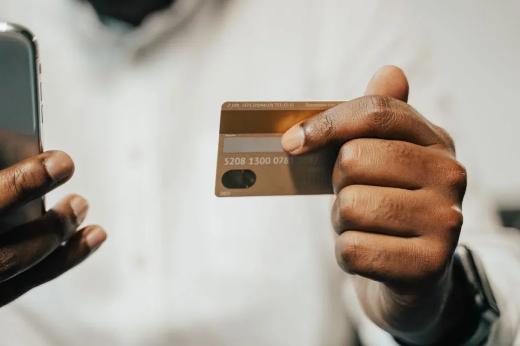 Hands holding a phone with banking apps