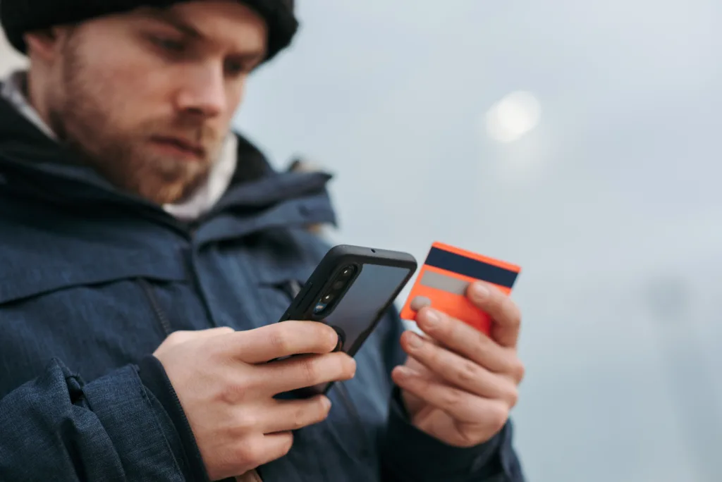 Man verifying account details on a mobile phone
