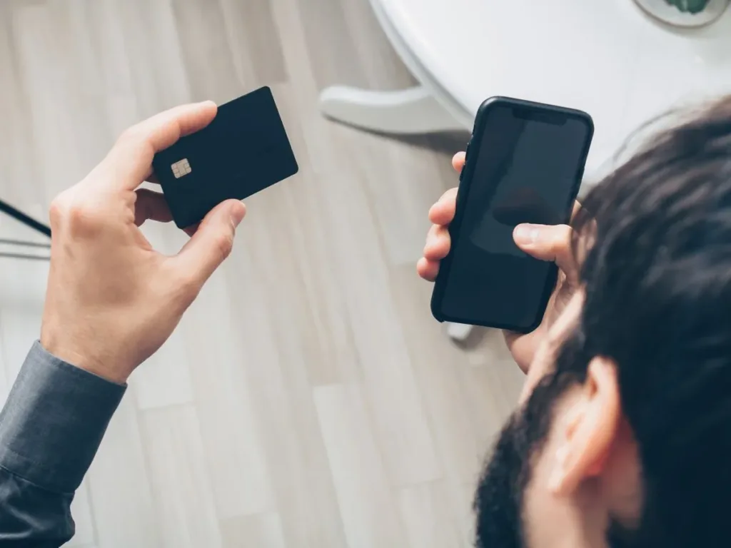 Man using a mobile e-wallet app to pay