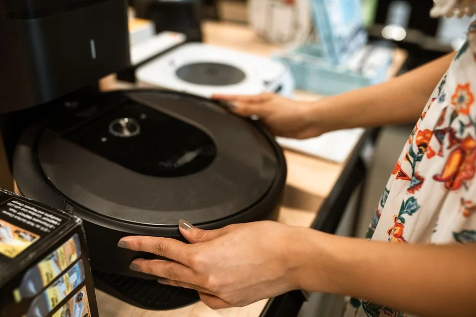 Customer examining a home appliance in a retail store before financing it