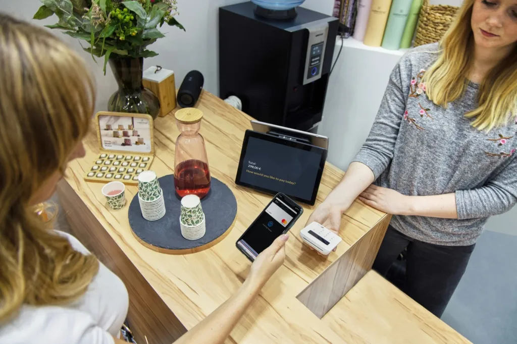 Small merchant accepting a digital payment at checkout