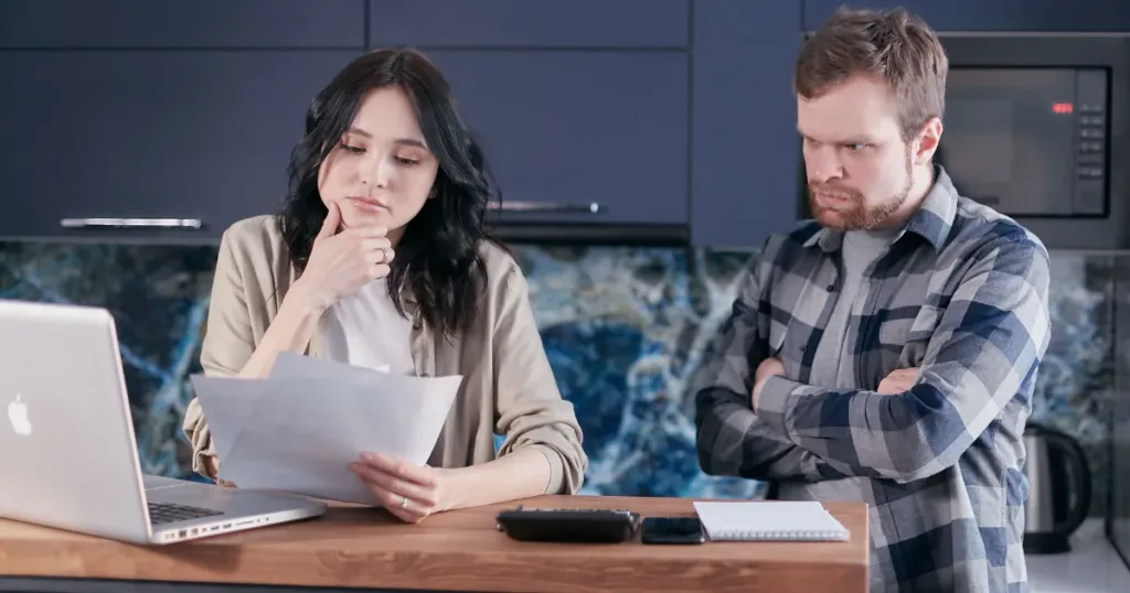Couple reviewing financial paperwork together