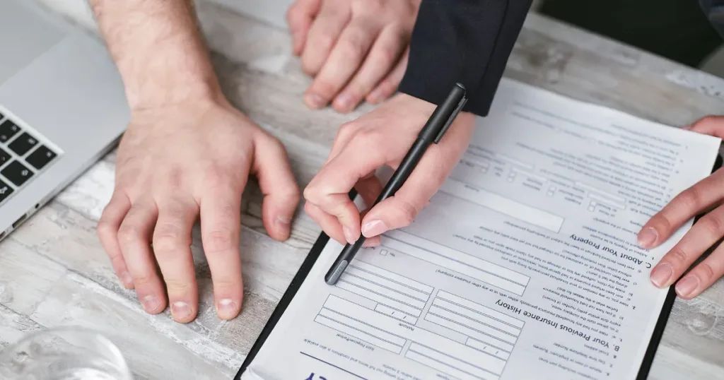 Person signing an insurance document