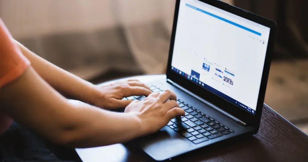 Young person using a laptop, representing students or unemployed users exploring credit options