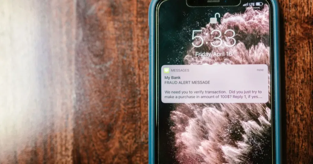 Smartphone screen showing a fraud alert warning notification