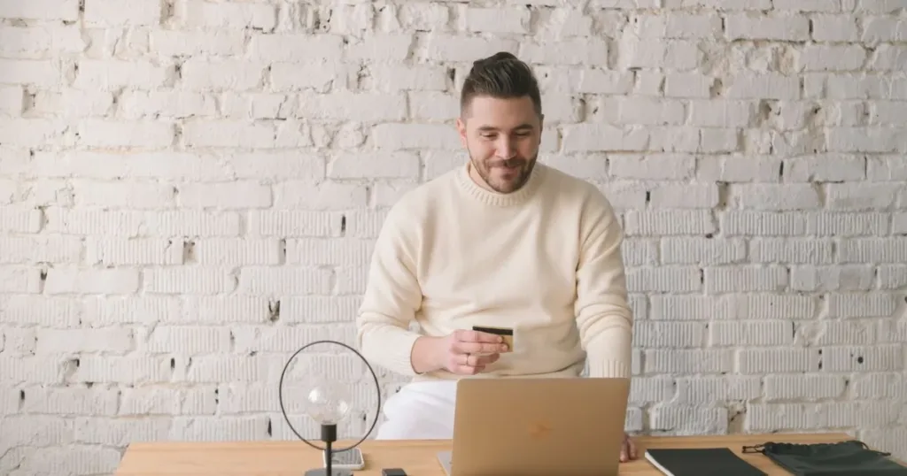 Man paying for an online purchase with a card
