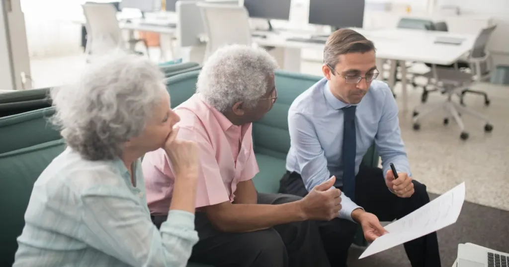 Financial advisor discussing debt review and consolidation options with clients
