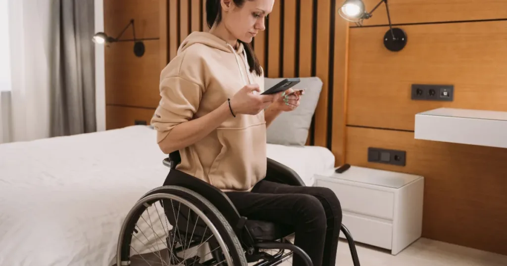 Person managing finances on a smartphone, representing a fixed-income disability grant recipient checking their budget
