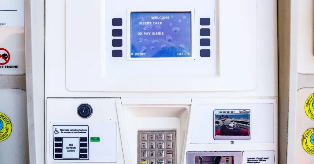 Person paying for fuel at a gas station