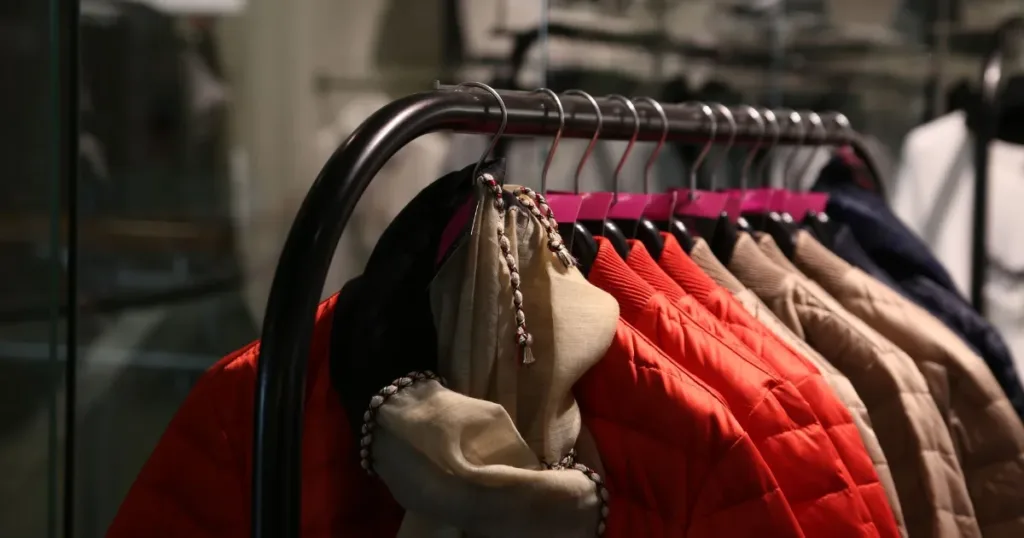 Colorful jackets hanging on a rack in a stylish clothing store
